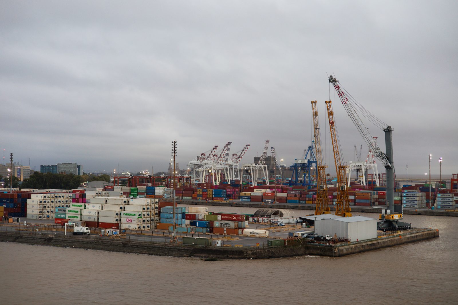 A busy container terminal with cranes and transport vehicles